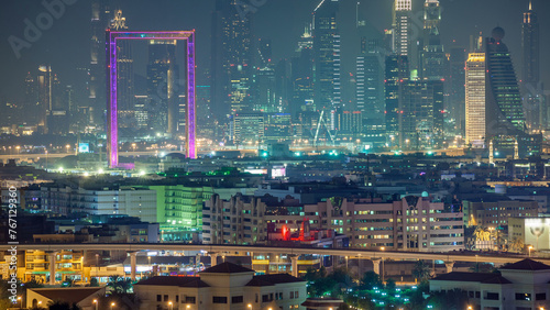 Dubai creek landscape night timelapse with boats and ship near waterfront photo