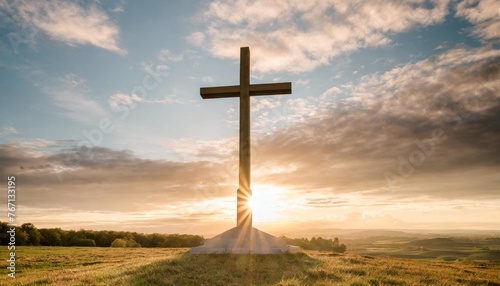 the cross of god in the rays of the sunset background