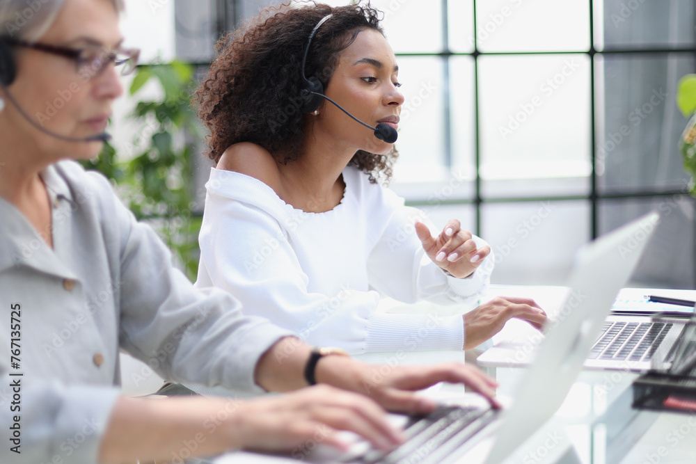 businesswoman working with a headset and accompanied. businesswoman working with a headset and accompanied.