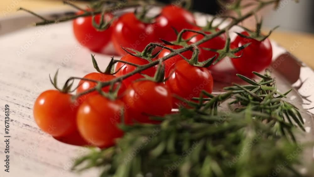 Fresh, farm-grown cherry tomatoes on a plate. Close up Fresh, farm-grown cherry tomatoes on a plate. Close up
