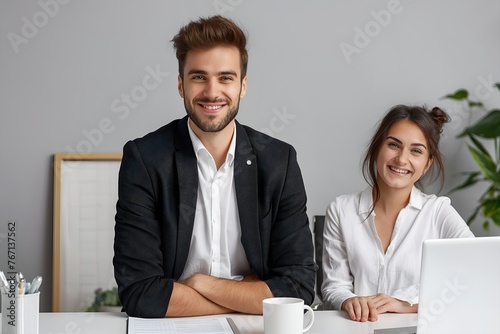 Young business partners posing smilingly and confidently together in their office photo