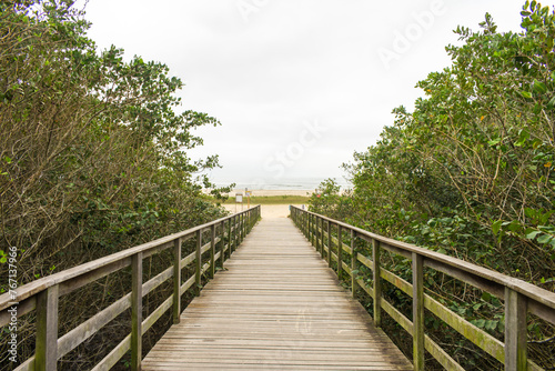 Wooden platform leading to Forte beach in S  o Francisco do Sul island - Santa Catarina  South of Brazil 