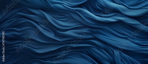 A close up of a fluid, electric blue silk cloth with a mesmerizing wind wave pattern, resembling the fluidity and movement of water