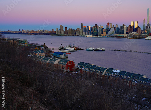 WEEHAWKEN, NJ -18 FEB 2024- Sunset view of the waterfront skyline in Manhattan, New York, seen from across the Hudson River in New Jersey.