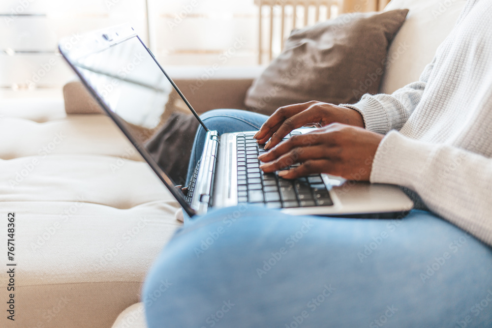 Fototapeta premium Young fashionable woman working at home. Young businesswoman working from home.