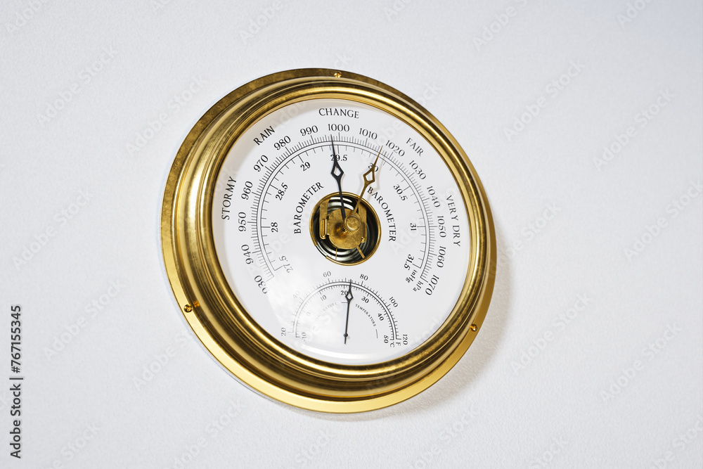 Elegant Antique Gold Barometer Against a Pristine White Background Elegant Antique Gold Barometer Against a Pristine White Background