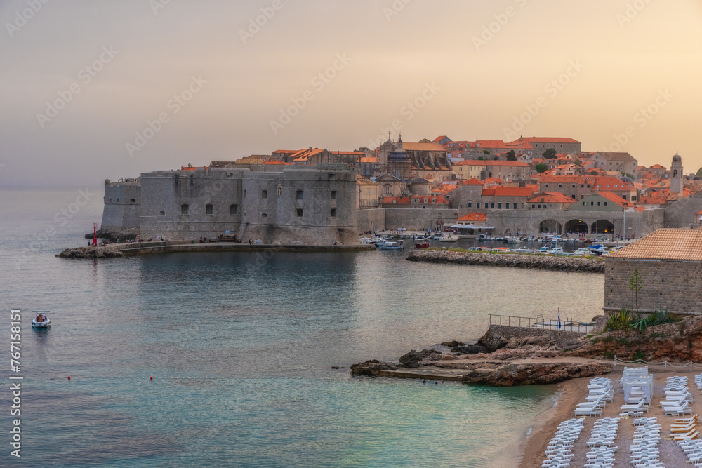 Sunset view on old town of Dubrovnik, Dalmatia, Croatia. Medieval fortress on the sea coast. Popular travel destination. Summer vacation background