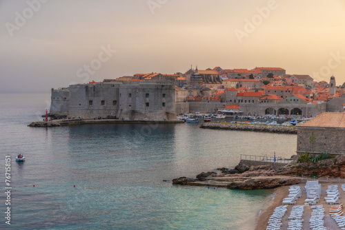 Fototapeta Naklejka Na Ścianę i Meble -  Sunset view on old town of Dubrovnik, Dalmatia, Croatia. Medieval fortress on the sea coast. Popular travel destination. Summer vacation background