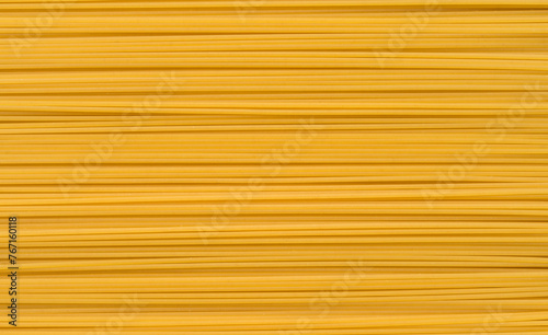 Spaghetti uncooked background, pasta texture top view 