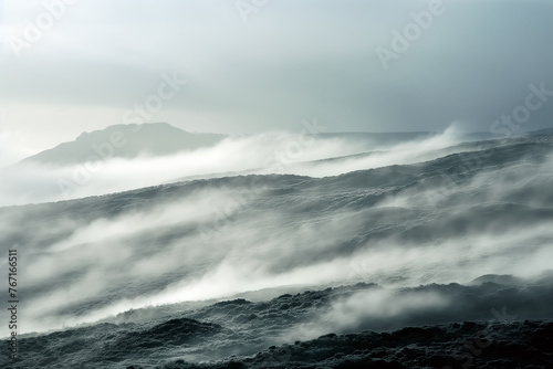 Natural evaporation and fog above the rocky mountain slope in nature.