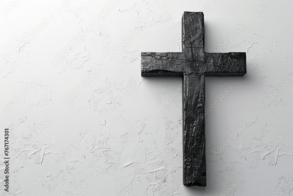 Black wooden cross on light white blank background with space for text or inscriptions, religious catholic background

