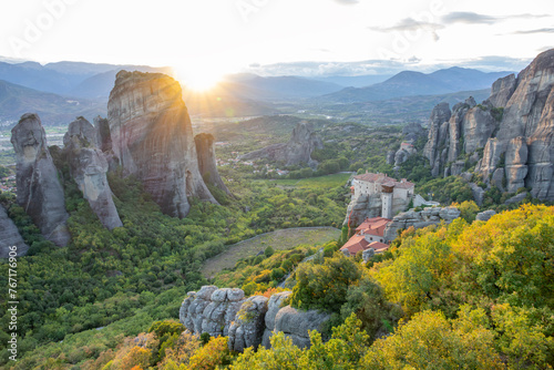 Sunset Rays over a Valley with a Greek Rock Monastery