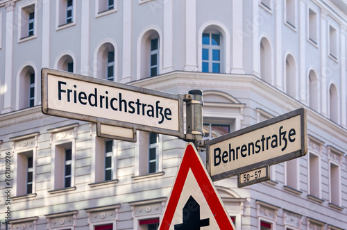 Berlin, Germany, March 8, 2024: streetname signs at the junction of Friedrichstrasse and Behrenstrasse in Mitte district