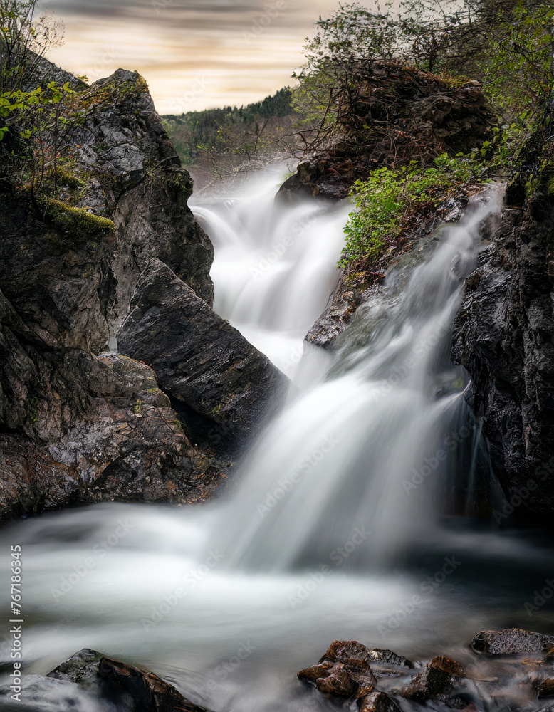 Fototapeta premium Waterfall landscape using a slow shutter speed