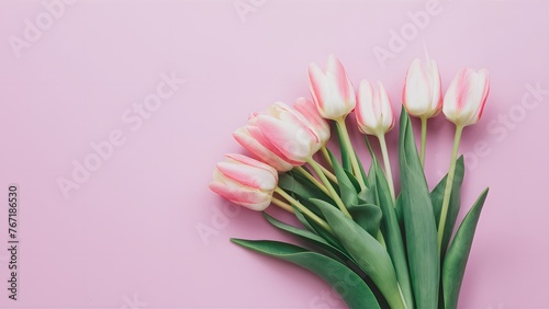 Lovely pastel pink tulips bunch on light background, top view #767186530