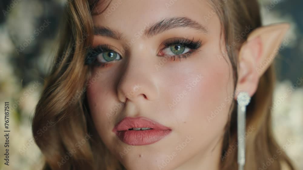 fantasy elf girl looking at camera with love emotion green eyes pink lips pointy ears, beauty smiling face, creative holiday makeup smokey cat eye blonde wavy hair. Fairy woman princess goddess art 4k