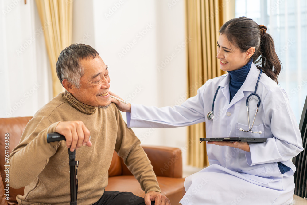 Obraz premium Portrait of smiling caring asian doctor service help support discussing and consulting taking care, caring, caregiver with senior elderly asian man at home visit.senior retirement home care