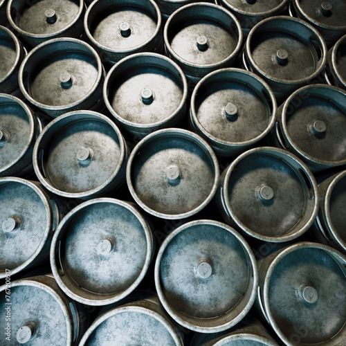Overhead Shot of Stacked Metal Industrial Drums in a Warehouse Setting