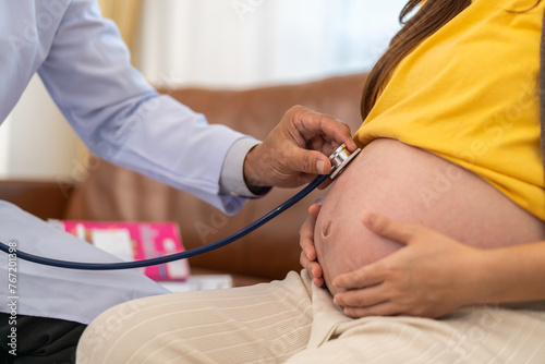 Senior asian man doctor support discussing and consulting care talk to mother woman checkup pregnancy baby in belly, woman pregnant, birth, maternity, ultrasound, healthcare and medicine in hospital