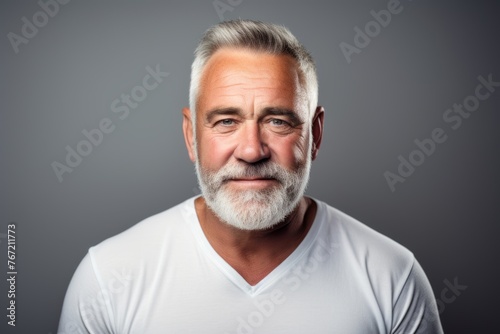Handsome senior man with grey beard and mustache. Studio shot.