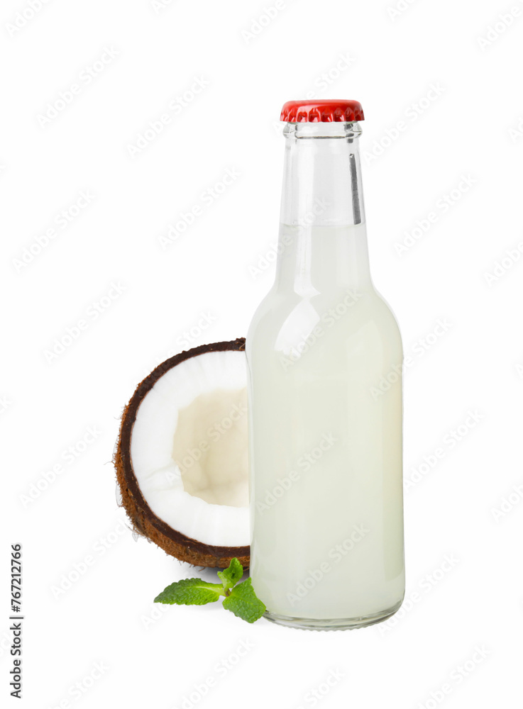 Delicious kombucha in glass bottle, coconut and mint isolated on white Delicious kombucha in glass bottle, coconut and mint isolated on white