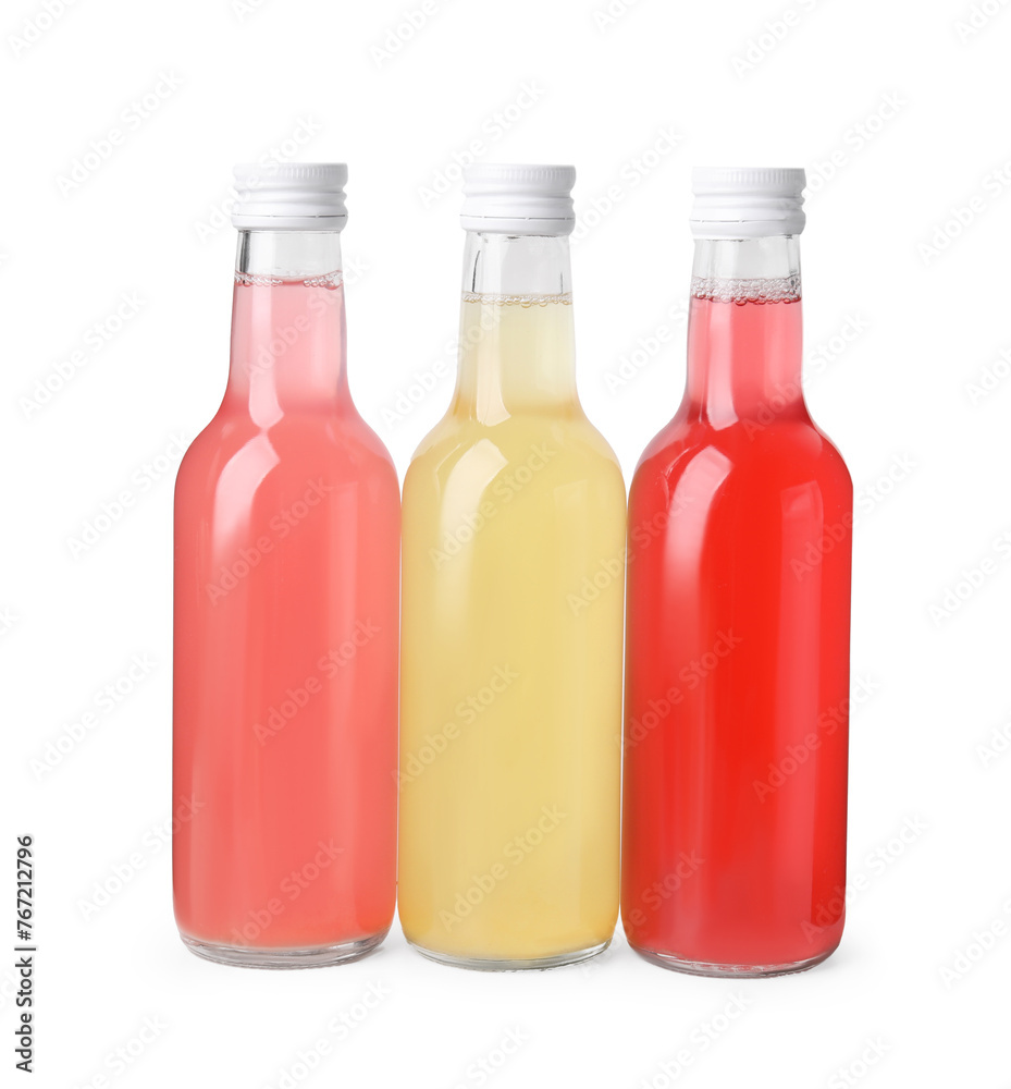 Delicious kombucha in glass bottles isolated on white