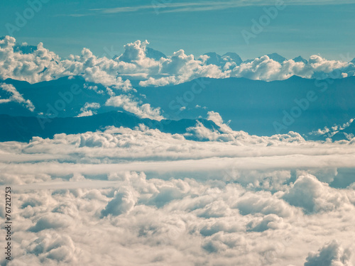 Aerial view of the peaks of Himalaya from Nagarkot, Nepal. Mount Everest behind the clouds. A sea of clouds and Himalayan peaks towering out