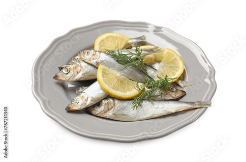 Fresh raw sprats, dill and cut lemon isolated on white