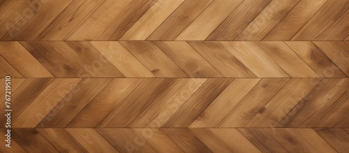 A close up of a hardwood floor with a herringbone pattern in shades of brown and beige  creating a beautiful and elegant look with rectangular and triangular shapes