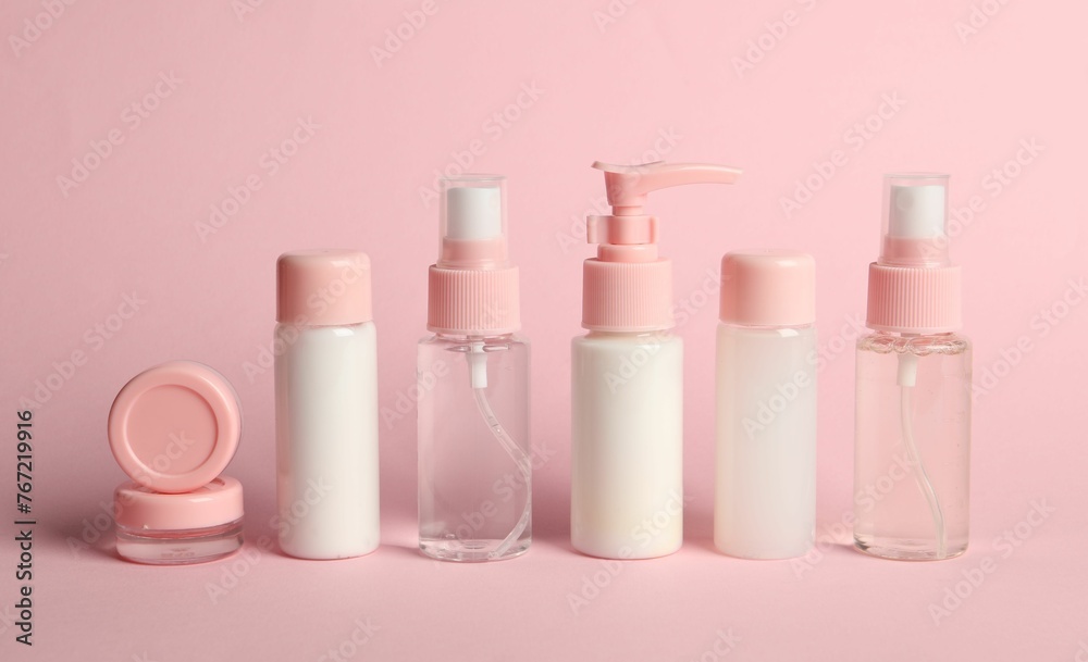 Cosmetic travel on pink background. Bath accessories Cosmetic travel on pink background. Bath accessories