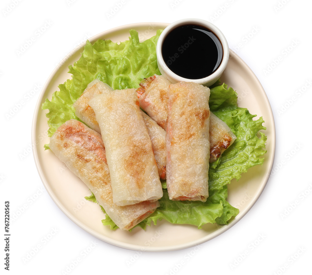 Delicious fried spring rolls with sauce isolated on white, top view
