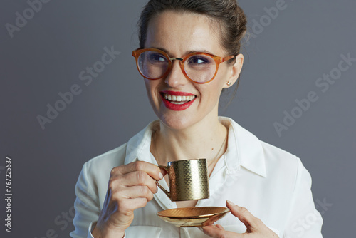 smiling 40 years old business woman isolated on grey