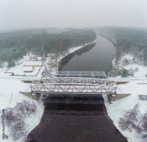 Railway Bridge over the River Neris in Santaka. Lithuania. Snowy Winter Day. Drone photo