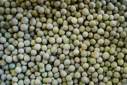 Dry green peas background, selective focus