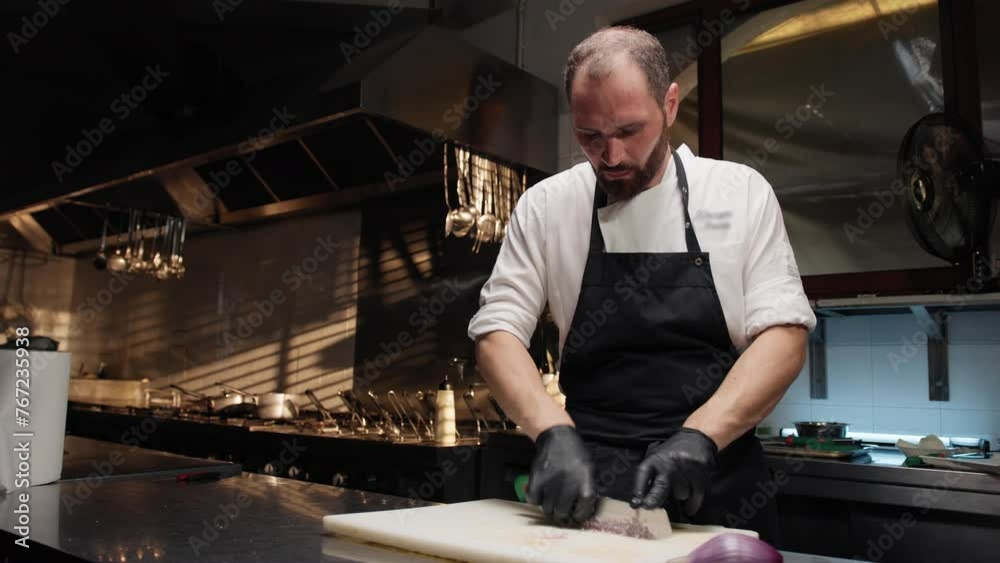 Chef slicing onion for a vegetarian meal 