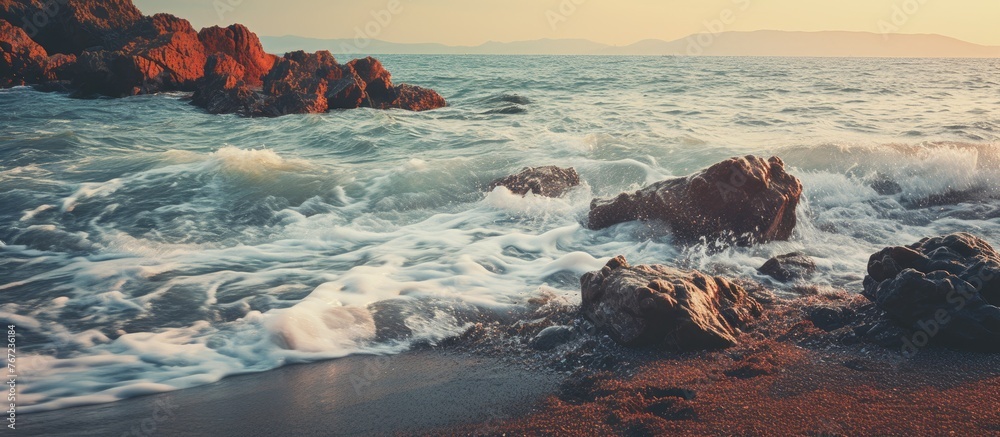 Rocks in foreground of expansive body of water Rocks in foreground of expansive body of water