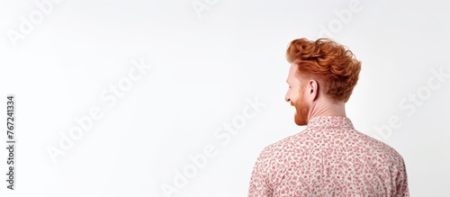 Man with crimson hair in pink shirt photo