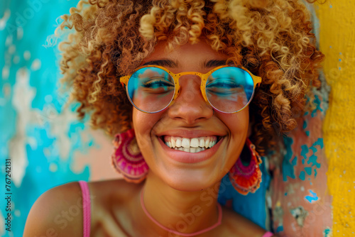 Joyful African American Woman with Afro Blond Hair Laughing in Colorful Fashion Glasses