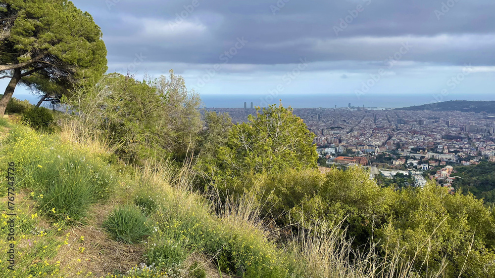 Panoramic view of Barcelona city from the hill, rainy spring weather landscape