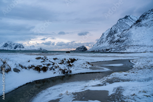 Bach fließt bei Haukland ins Meer photo