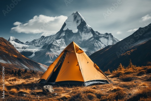 Snowy peaks mountain camping adventure at the foot of majestic snow-capped mountains