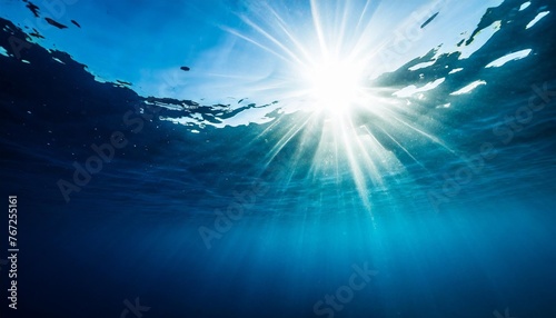 sun shining light in blue clearly deep water sunbeams illuminate the blue underwater sea scene background