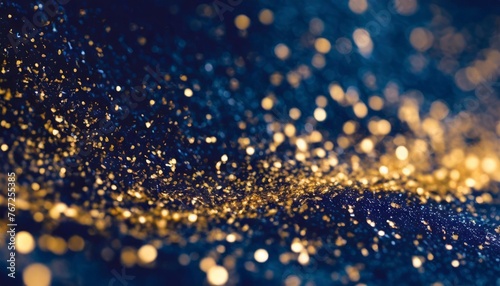 dark blue de focused sparkle glitter background with golden particles close up