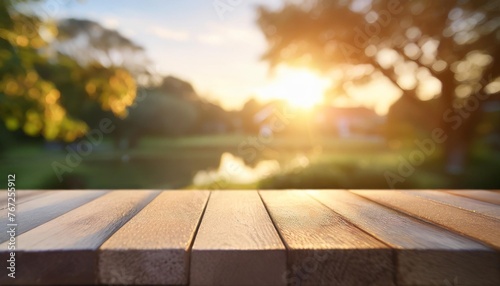 empty wooden table top with blur garden background with bokeh for product display stage podium © Heaven