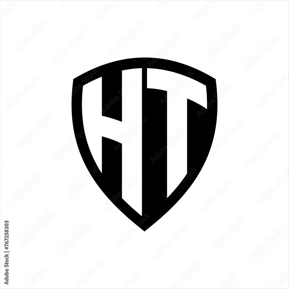 HT monogram logo with bold letters shield shape with black and white color design HT monogram logo with bold letters shield shape with black and white color design