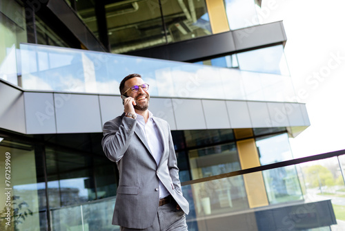 Confident Businessman Smili...