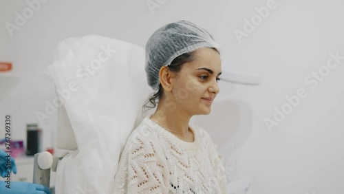 Preparation of a cosmetologist before anti-aging injections into a womans face