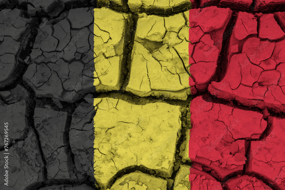 Dry soil pattern on the flag of Belgium. Country with drought concept due to climate change. Water problem. Dry cracked earth country.