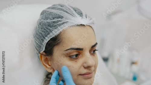 Young woman beauty injection preparation concept, face marking