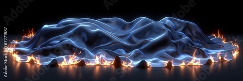 Blue draped cloth with edges on fire